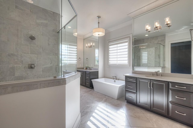 bathroom with a stall shower, two vanities, a sink, and a washtub