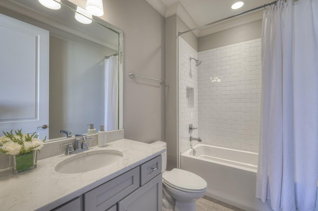 bathroom featuring toilet, shower / bath combination with curtain, and vanity