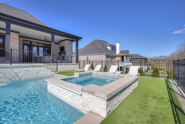 view of pool featuring a fenced in pool, a fenced backyard, ceiling fan, and an in ground hot tub