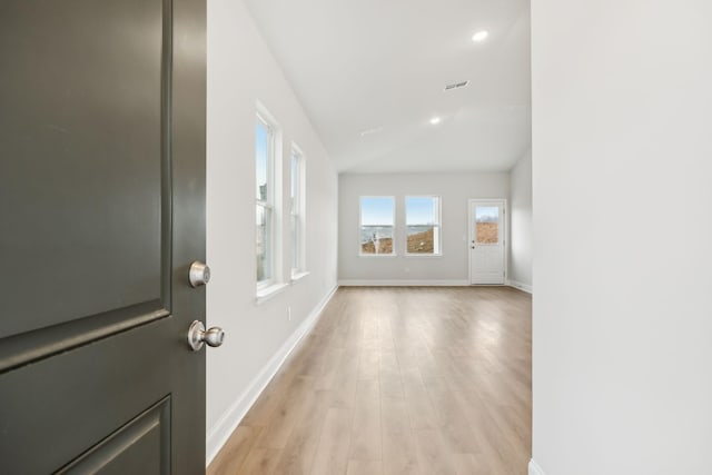 entrance foyer with visible vents, baseboards, light wood-style flooring, vaulted ceiling, and recessed lighting