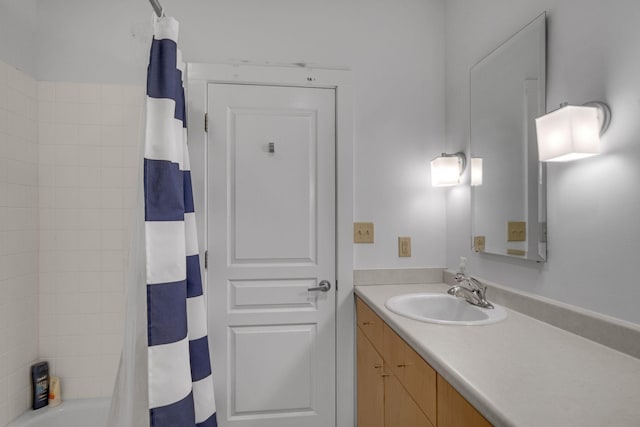 bathroom with shower / bath combo and vanity