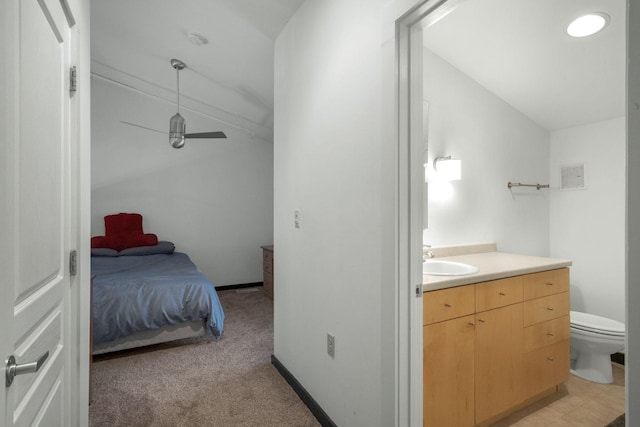 bathroom featuring visible vents, baseboards, toilet, lofted ceiling, and vanity