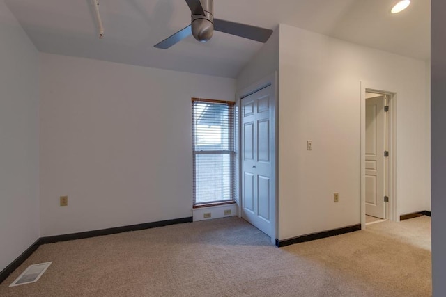 unfurnished bedroom with recessed lighting, light carpet, a ceiling fan, visible vents, and baseboards