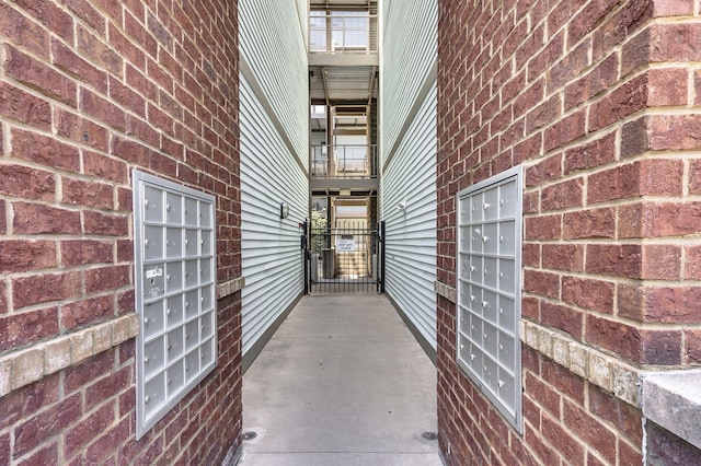 doorway to property with brick siding