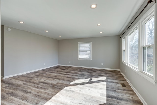 1311 Bel Aire Dr, Tullahoma, TN 37388 - unfurnished room featuring plenty of natural light, recessed lighting, wood finished floors, baseboards, and a smoke detector