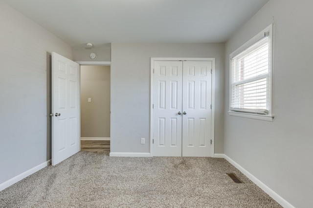 1311 Bel Aire Dr, Tullahoma, TN 37388 - unfurnished bedroom featuring carpet floors, a closet, and baseboards