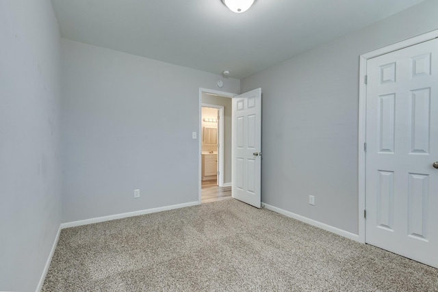 1311 Bel Aire Dr, Tullahoma, TN 37388 - unfurnished bedroom with light colored carpet and baseboards