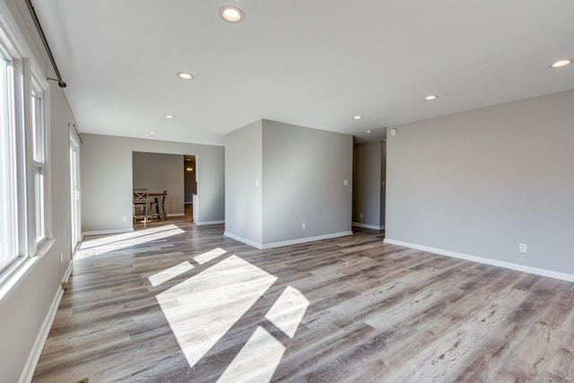 1311 Bel Aire Dr, Tullahoma, TN 37388 - spare room featuring recessed lighting, baseboards, and light wood-style floors