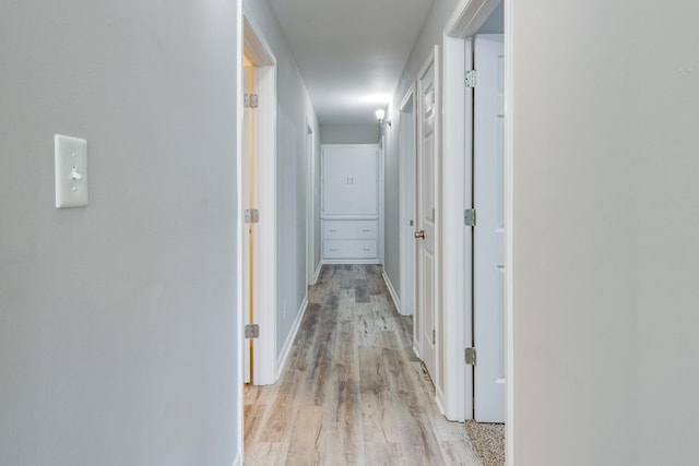 1311 Bel Aire Dr, Tullahoma, TN 37388 - hallway featuring light wood-type flooring and baseboards
