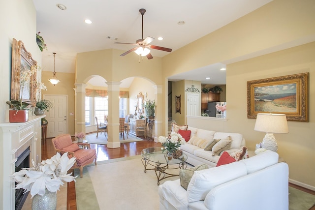 living area featuring ornate columns, visible vents, a ceiling fan, and recessed lighting