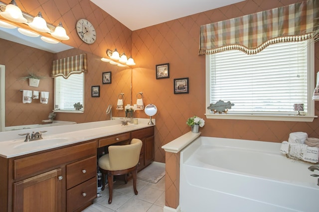 bathroom with a garden tub, double vanity, a sink, tile patterned flooring, and wallpapered walls