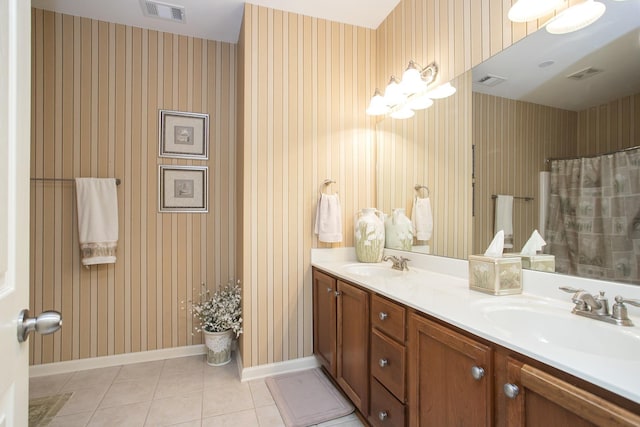 full bathroom with a sink, visible vents, and wallpapered walls