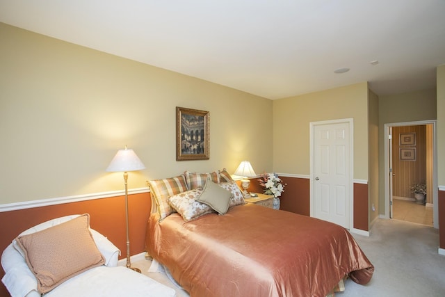 bedroom featuring carpet floors and baseboards