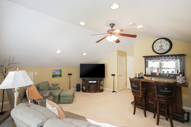 carpeted living room featuring recessed lighting, vaulted ceiling, a bar, and ceiling fan