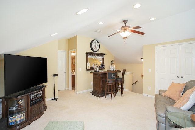 living area featuring light carpet, recessed lighting, baseboards, and lofted ceiling