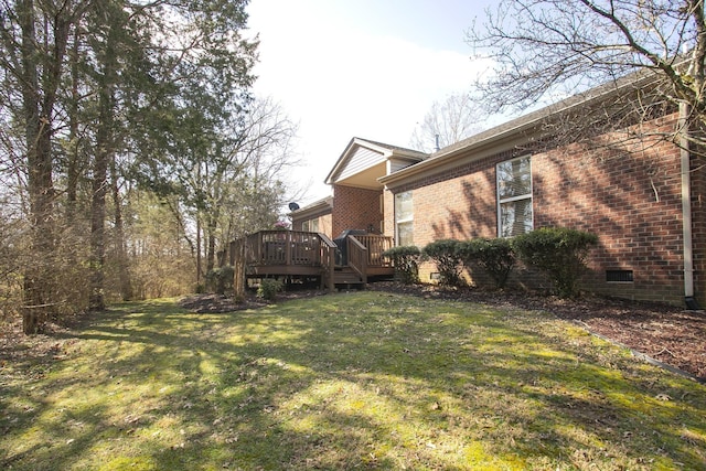 view of yard featuring a wooden deck