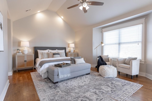 bedroom featuring a ceiling fan, wood finished floors, visible vents, and baseboards