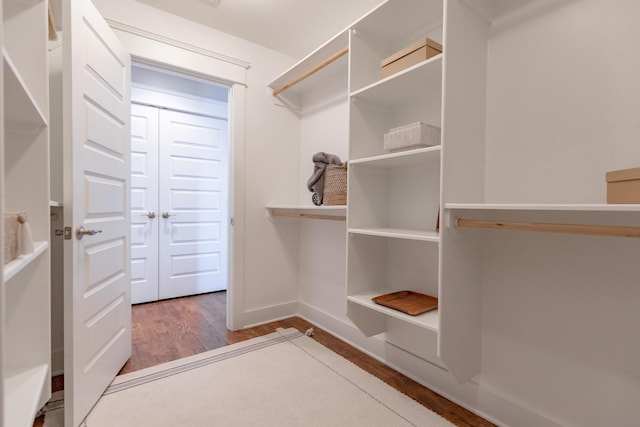 spacious closet with wood finished floors