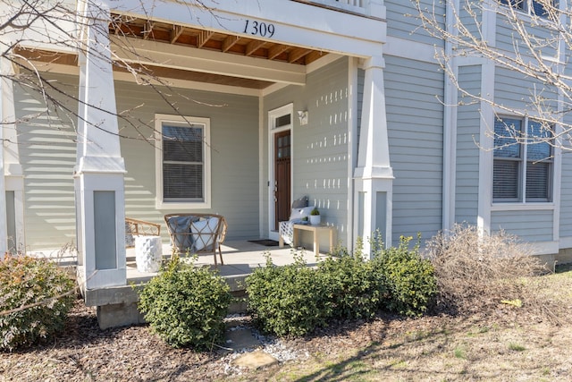 entrance to property featuring a porch