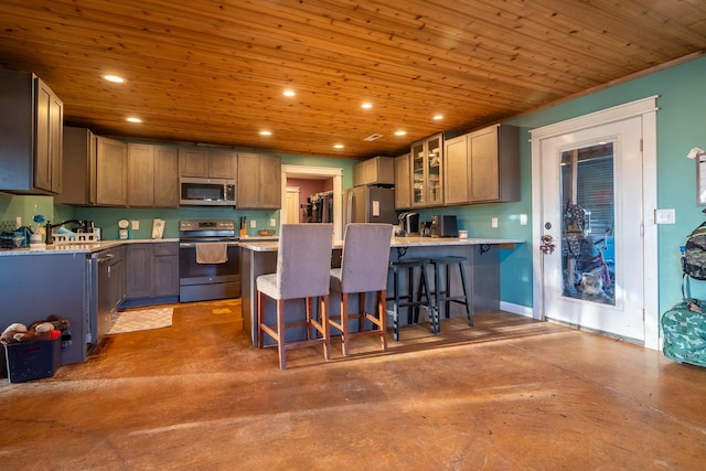 kitchen featuring a peninsula, wood ceiling, stainless steel appliances, and recessed lighting