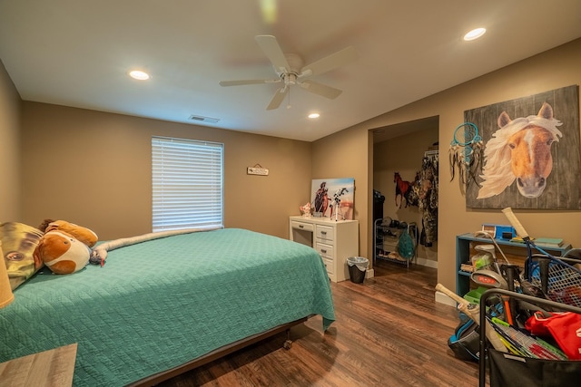 bedroom featuring dark wood-style floors, vaulted ceiling, visible vents, and recessed lighting