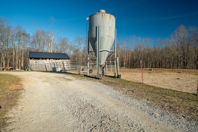 exterior space featuring dirt driveway