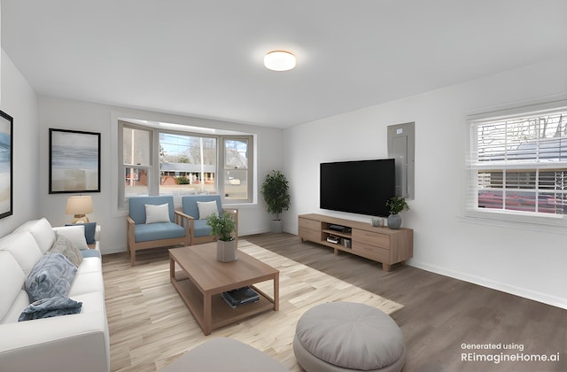 living area with wood finished floors and baseboards