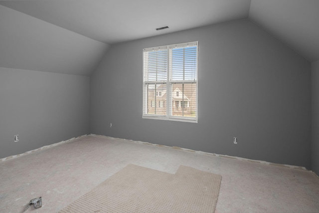 bonus room featuring visible vents and vaulted ceiling