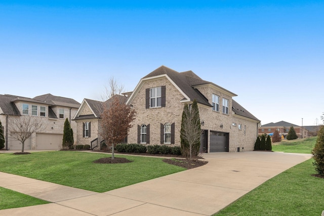 view of front of home with a garage, a front yard, concrete driveway, and brick siding