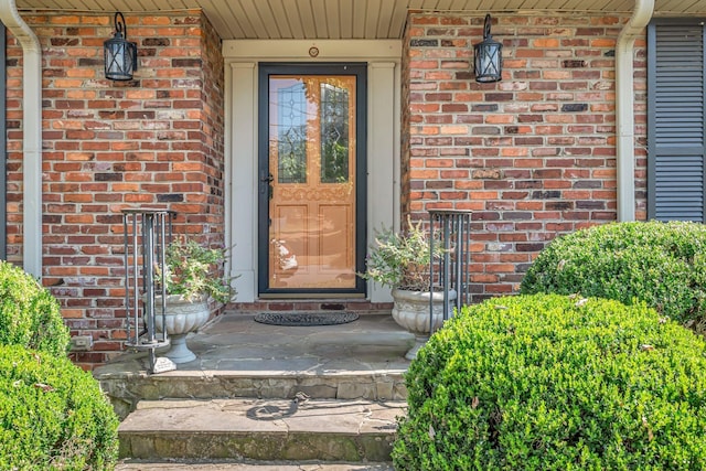 property entrance with brick siding