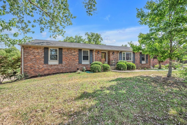 ranch-style house with brick siding and a front lawn