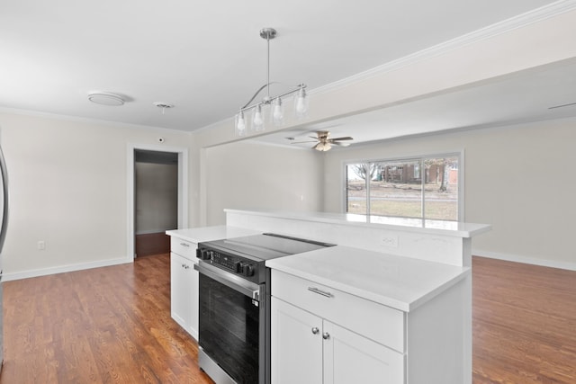 kitchen featuring dark wood-style floors, electric stove, and ornamental molding