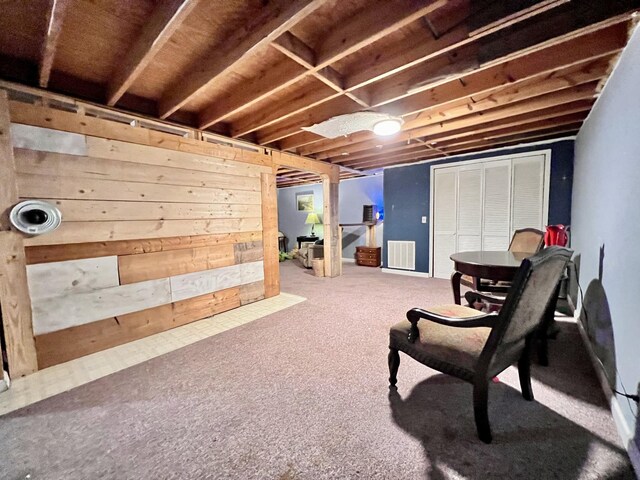 sitting room with visible vents and carpet flooring