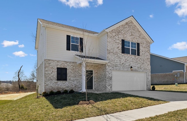 traditional-style home with concrete driveway, a front lawn, an attached garage, and brick siding