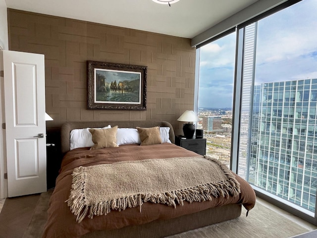 bedroom with a view of city