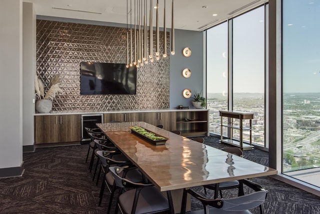 bar with wine cooler and expansive windows