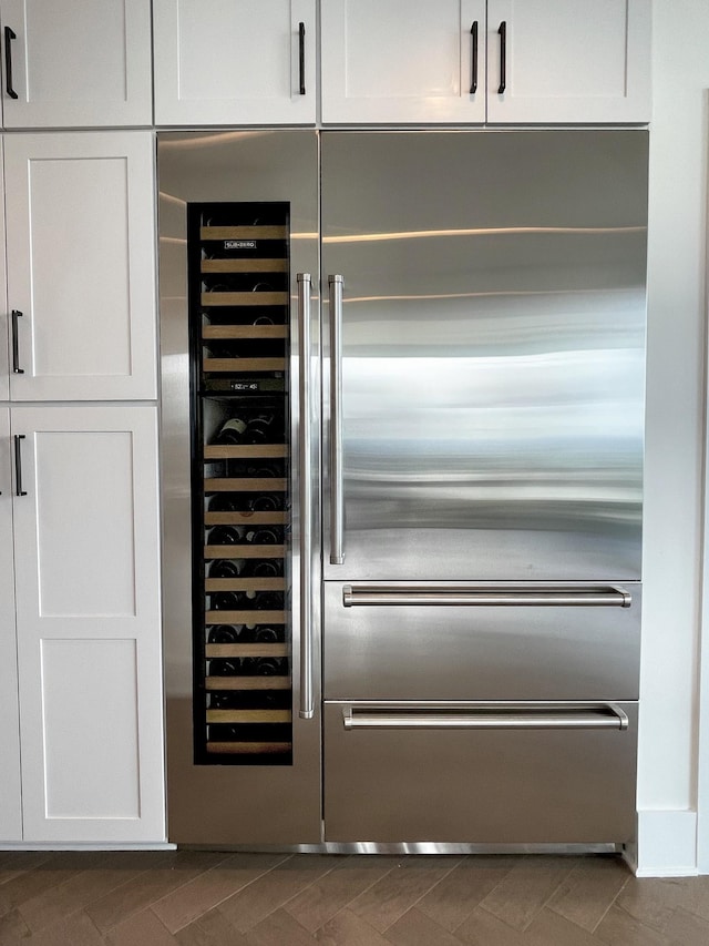 bar featuring stainless steel built in fridge