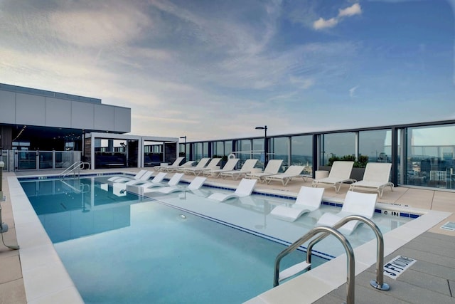 view of swimming pool featuring a patio