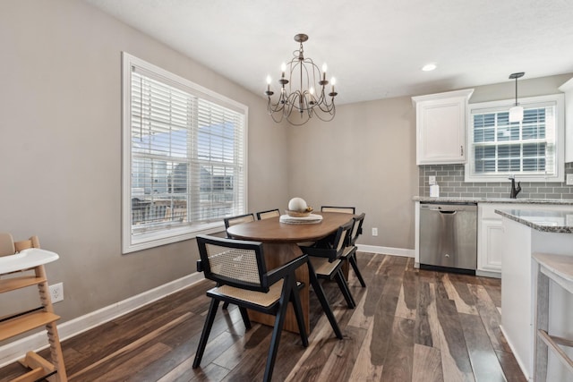 dining room with a notable chandelier, baseboards, dark wood-style flooring, and recessed lighting