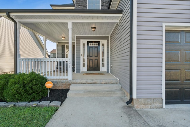 doorway to property with a porch