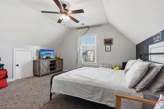 bedroom with lofted ceiling, ceiling fan, a textured ceiling, visible vents, and carpet