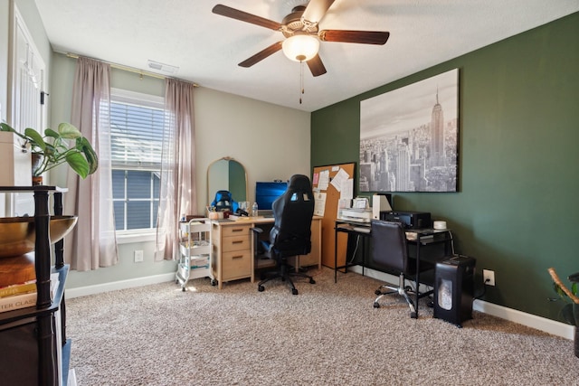 office area with baseboards, visible vents, and carpet flooring