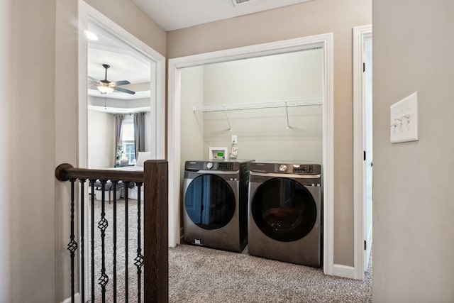 laundry room featuring laundry area, ceiling fan, separate washer and dryer, and carpet flooring