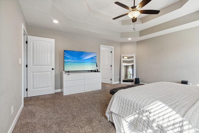 bedroom featuring carpet, baseboards, a raised ceiling, and recessed lighting