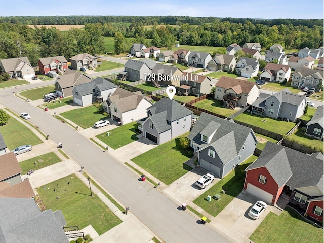 birds eye view of property with a residential view