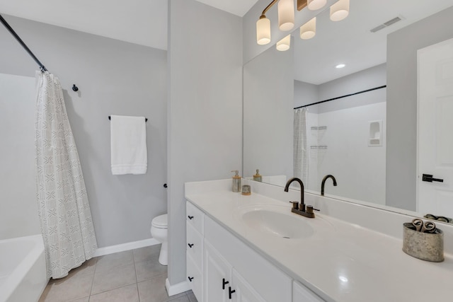 bathroom with tile patterned flooring, toilet, visible vents, vanity, and baseboards