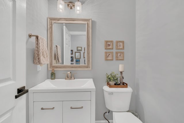 half bath with toilet and vanity