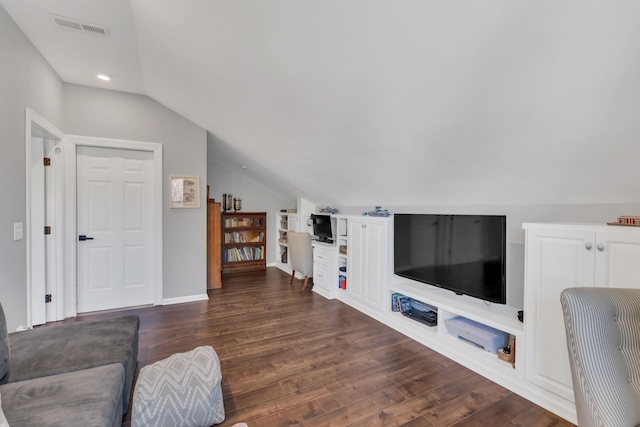 living area with lofted ceiling, visible vents, and dark wood finished floors