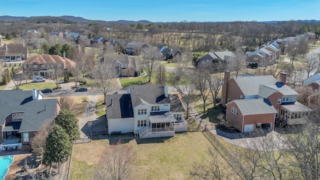 drone / aerial view with a residential view and a mountain view