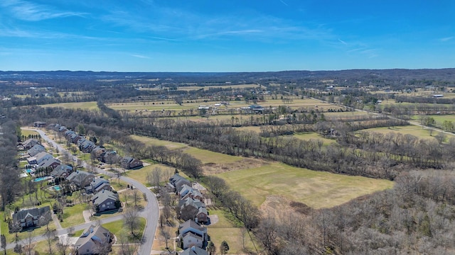 birds eye view of property with a rural view